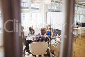 Creative business people discussing in meeting room