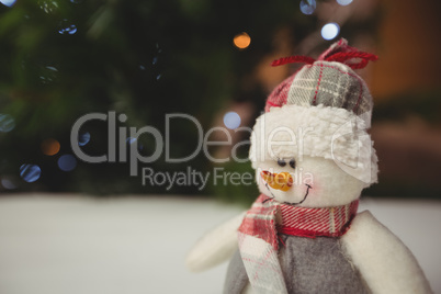 Close-up of snowman on wooden table