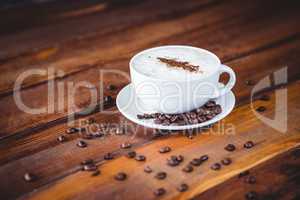 Coffee cup and beans on a table