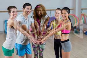 Group of fitness team with hand stacked
