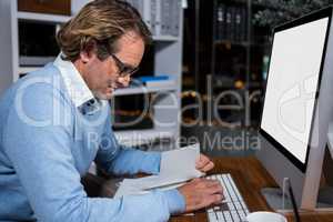 Businessman working on computer in office