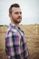 Portrait of farmer standing in the field