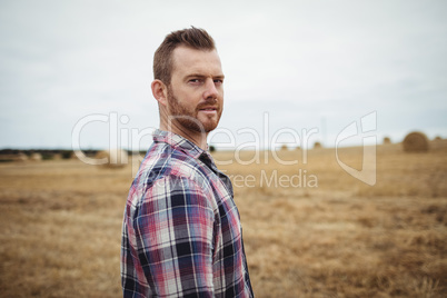 Portrait of farmer standing in the field