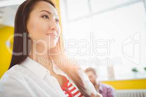 Low angle view of thoughtful businesswoman at creative office