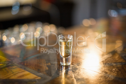 Tequila shot glass on counter