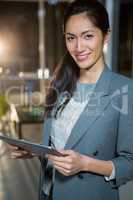 Businesswoman holding digital tablet