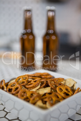 Bowl of snacks on bar counter