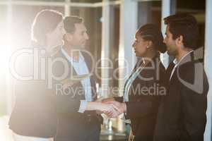 Group of businesspeople shaking hands with each other