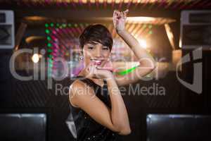 Young woman dancing on dance floor