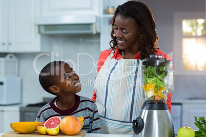 Mother and son smiling and looking at each other