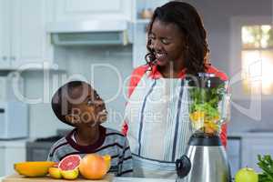 Mother and son smiling and looking at each other