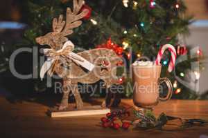 Cup of coffee and christmas decoration on wooden table