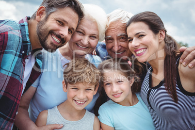 Happy multi-generation family standing  outdoors