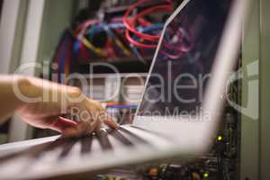 Technician working on laptop