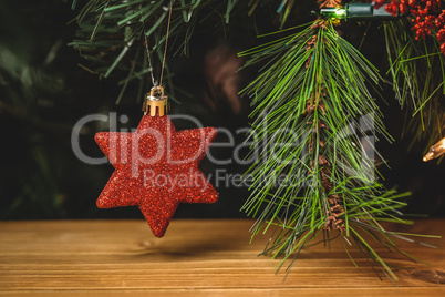 Close-up of christmas star hanging on christmas tree