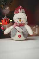 Close-up of snowman on wooden table