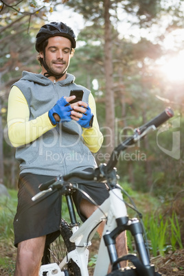 Mountain biker using mobile phone