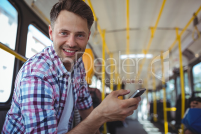 Portrait of handsome man using mobile phone