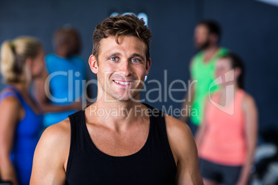 Portrait of happy young man in gym