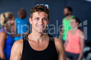 Portrait of happy young man in gym