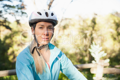 Portrait of female mountain biker in the forest
