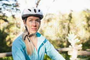 Portrait of female mountain biker in the forest