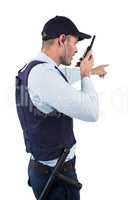 Security officer talking on walkie-talkie