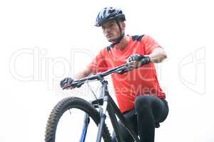 Male cyclist cycling in countryside