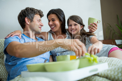 Happy family having breakfast