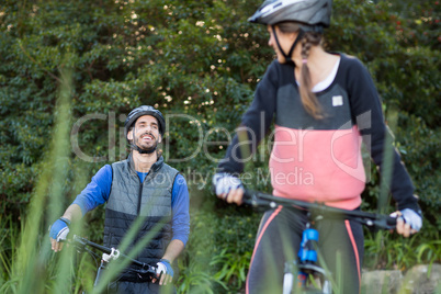 Biker couple cycling in countryside