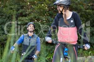 Biker couple cycling in countryside