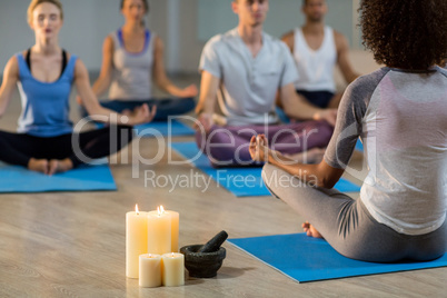 Instructor taking yoga class