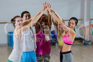 Group of fitness team with hand stacked