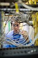 Technician fixing cable