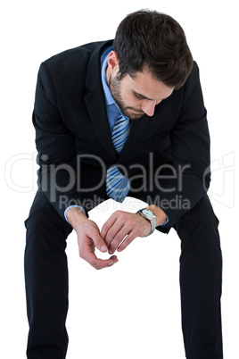 Businessman checking time