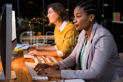 Businesswomen working on computer at their desk
