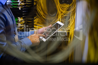 Technician using digital tablet