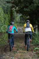 Biker couple cycling in countryside