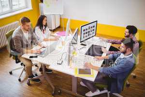 High angle view of editors working at creative office