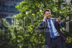 Handsome businessman talking on mobile phone