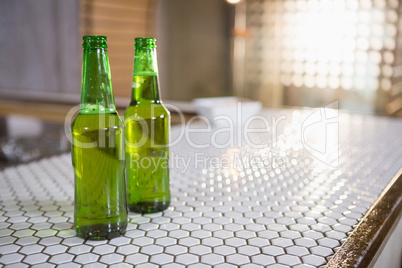 Bottle of beer on bar counter