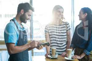 Customer making payment through payment terminal