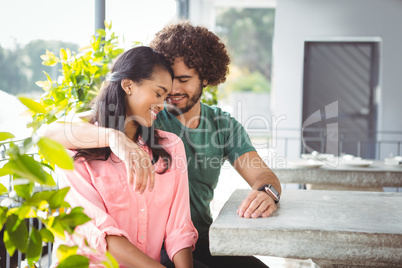 Couple romancing in cafeteria