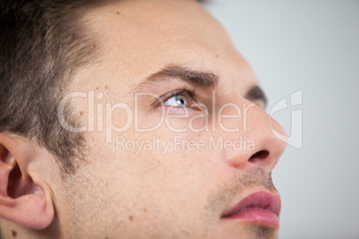 Close-up of man wearing contact lens