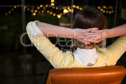 Businesswoman sitting on chair looking out of window