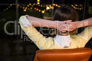 Businesswoman sitting on chair looking out of window