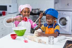 Children preparing cake