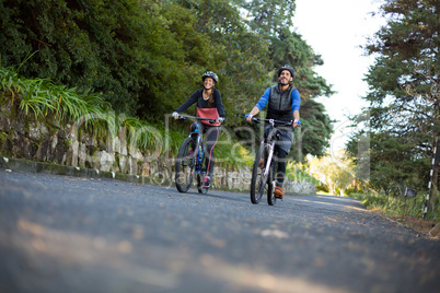 Biker couple cycling on the countryside road