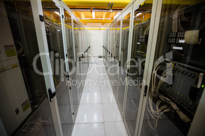 Hallway with a row of servers