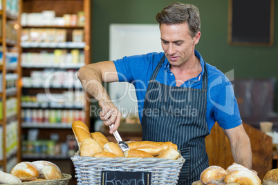 Male staff working at bakery store